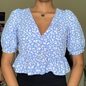 blue shirt with white flowers